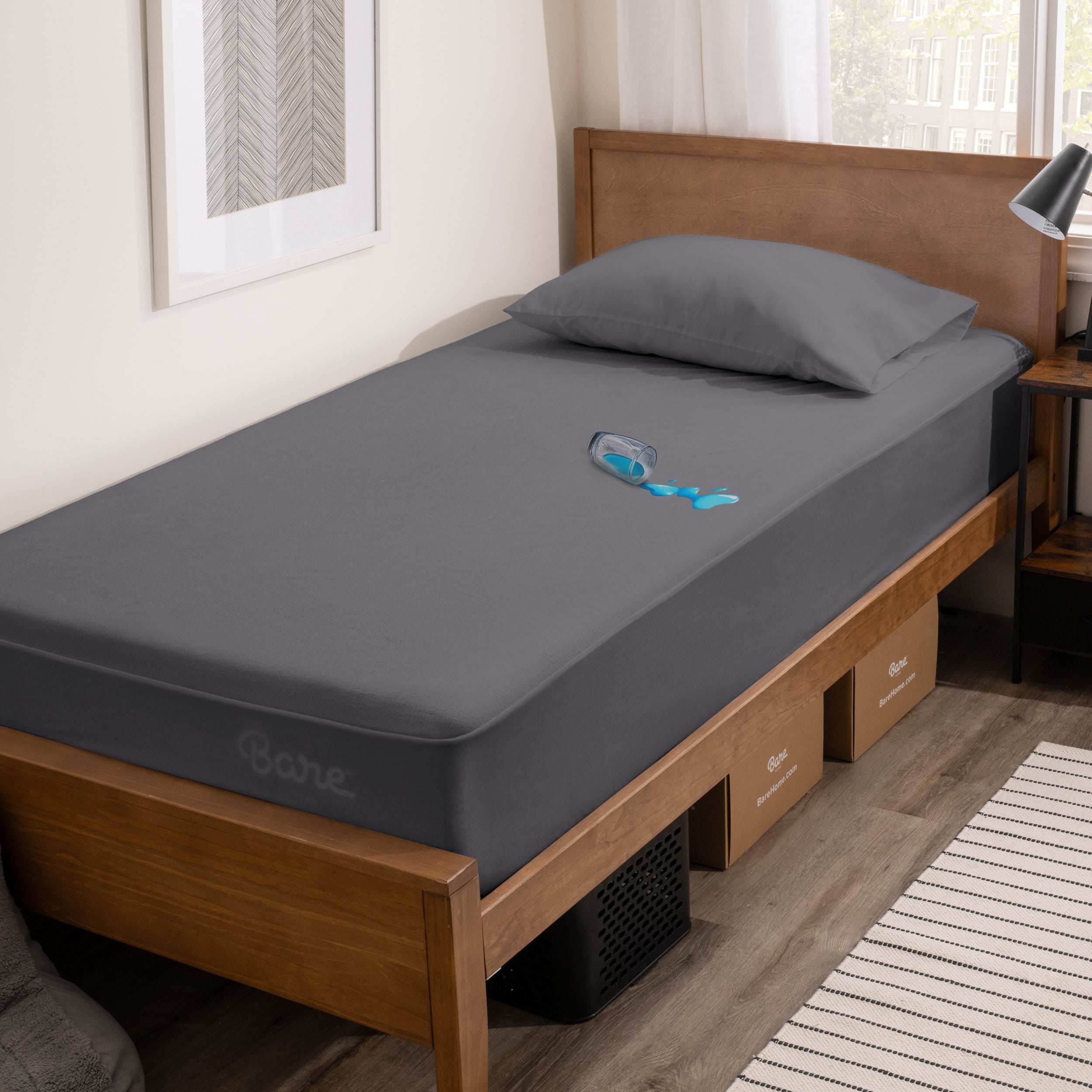 A glass of water spilled on a mattress protector
