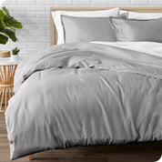 A modern bed with a flannel duvet cover set consisting of the duvet cover and two pillows.