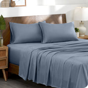 Two pillowcases on pillows on a bed with matching sheets