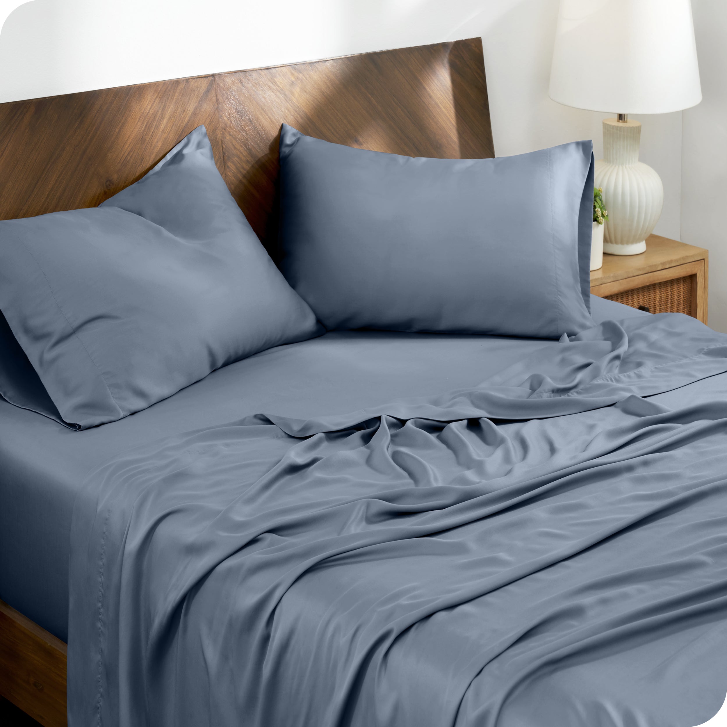 TENCEL™ Lyocell sheets on a bed. The flat sheet is folded over itself slightly.