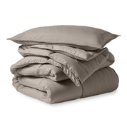 A microfiber comforter folded neatly with a pillow from above