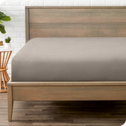 End of bed view with fitted sheet made on the mattress of a modern bed. 