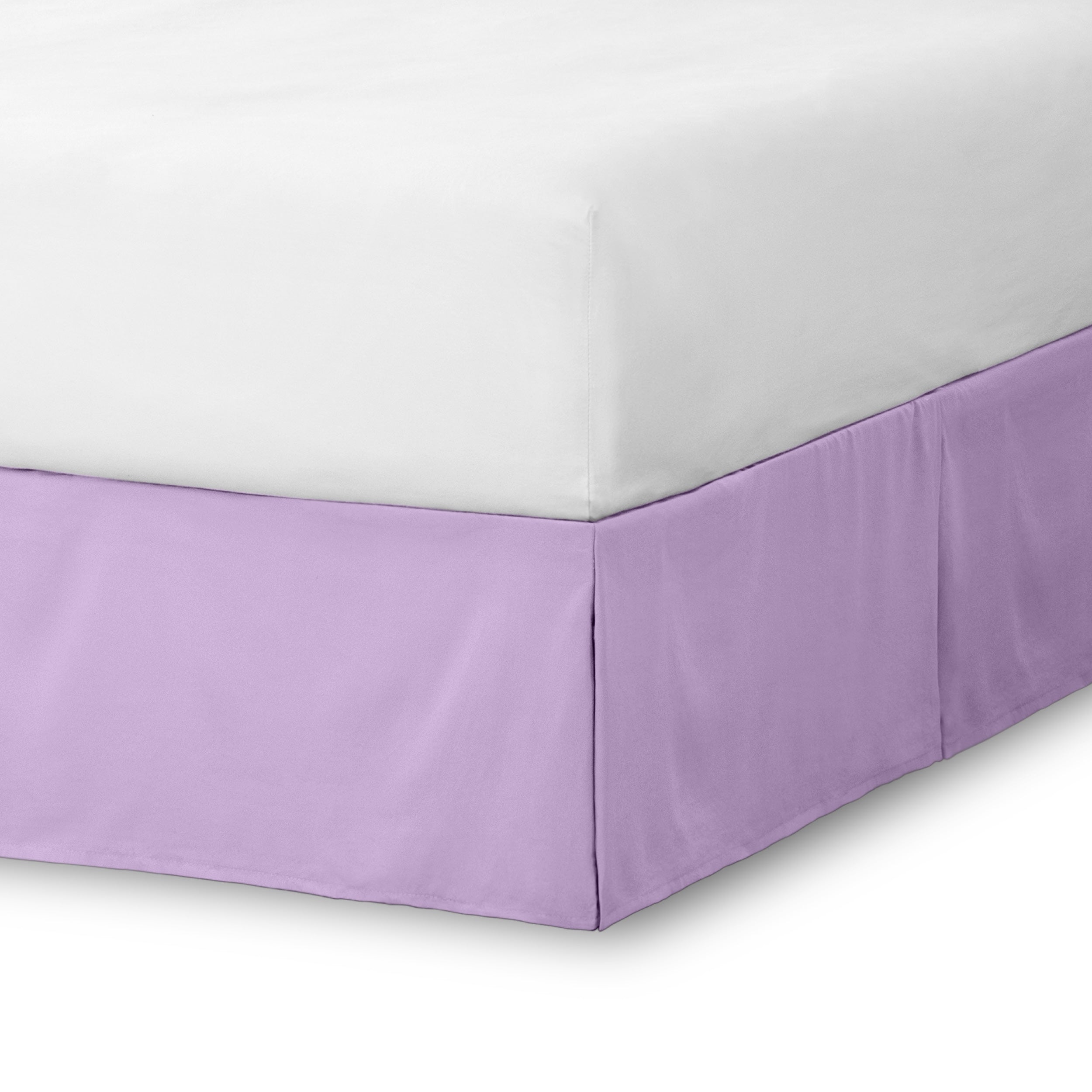 The corner of a bed skirt on a bed frame