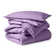 A microfiber comforter folded neatly with a pillow from above