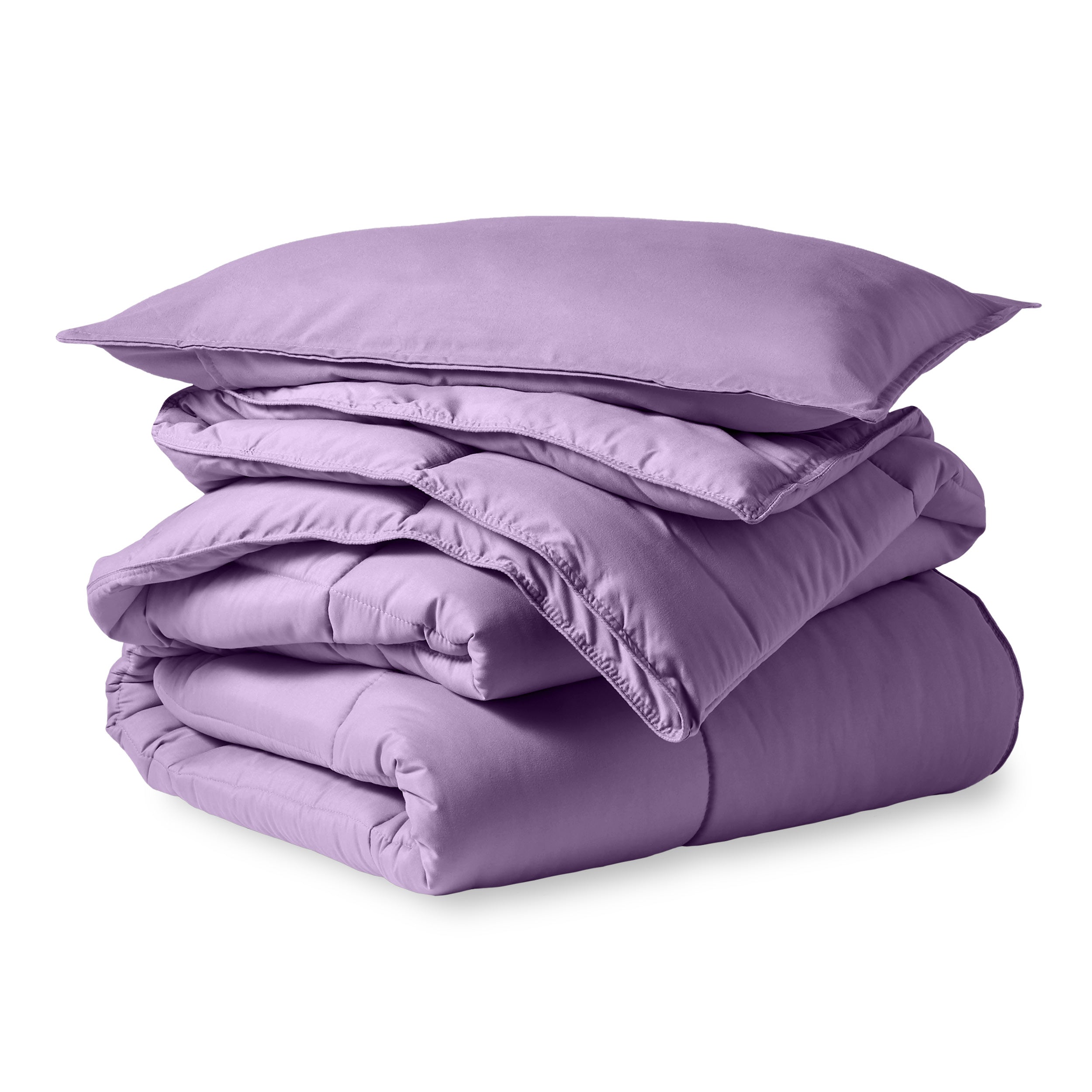 A microfiber comforter folded neatly with a pillow from above