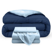 A reversible microfiber comforter and a coordinating sheet set folded and stacked 