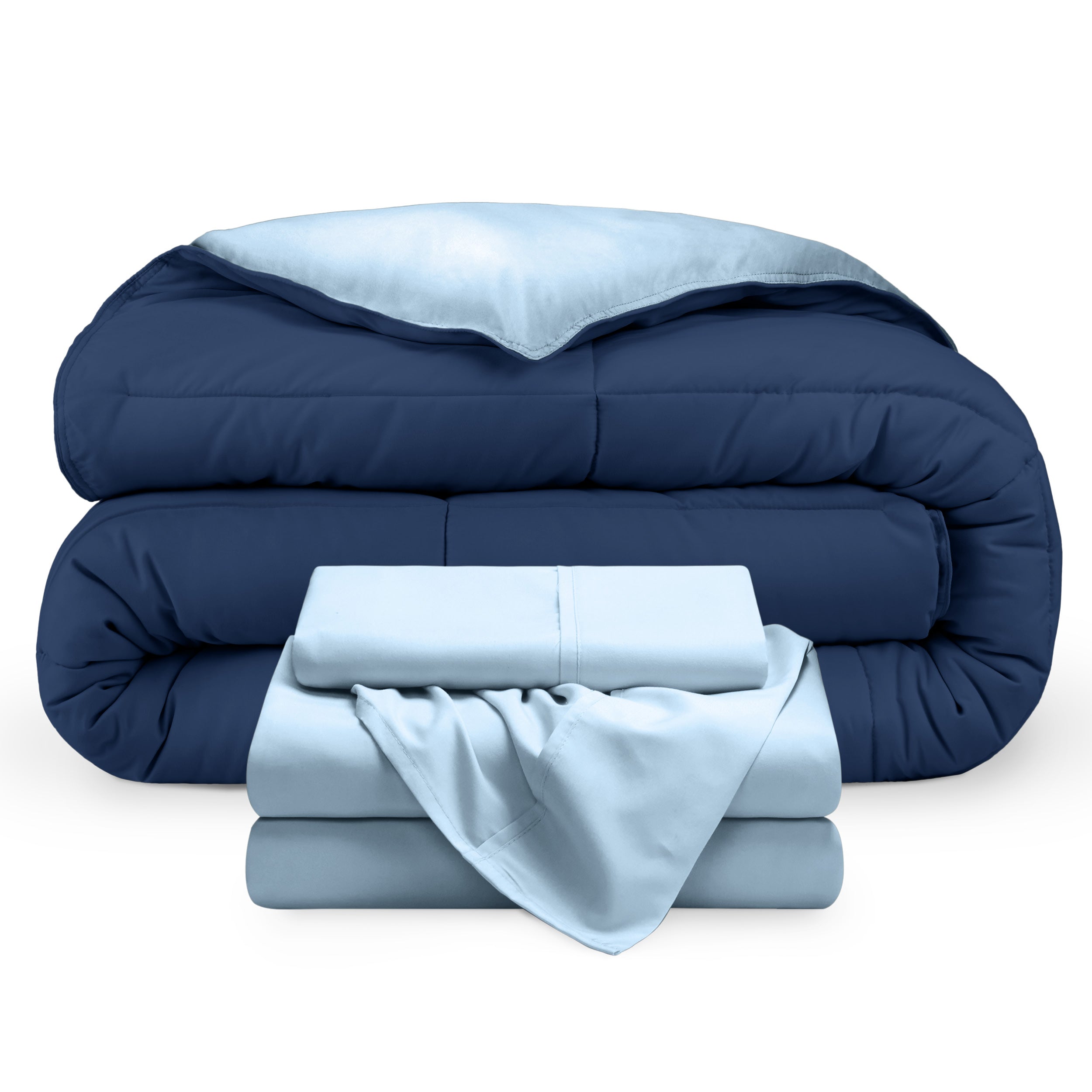 A reversible microfiber comforter and a coordinating sheet set folded and stacked 