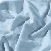 A close view of a button and lining on the flannel duvet cover.