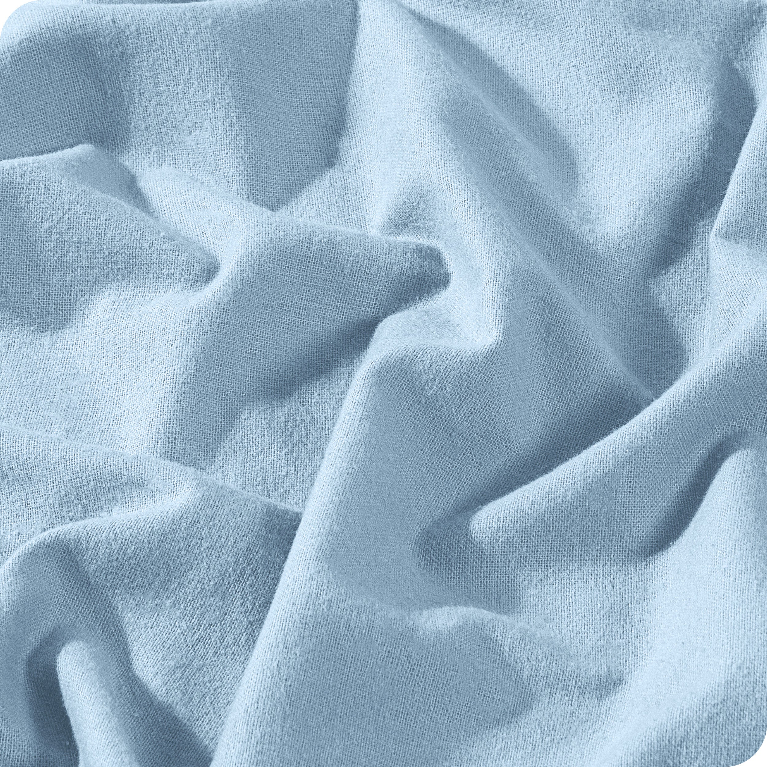 A close view of a button and lining on the flannel duvet cover.