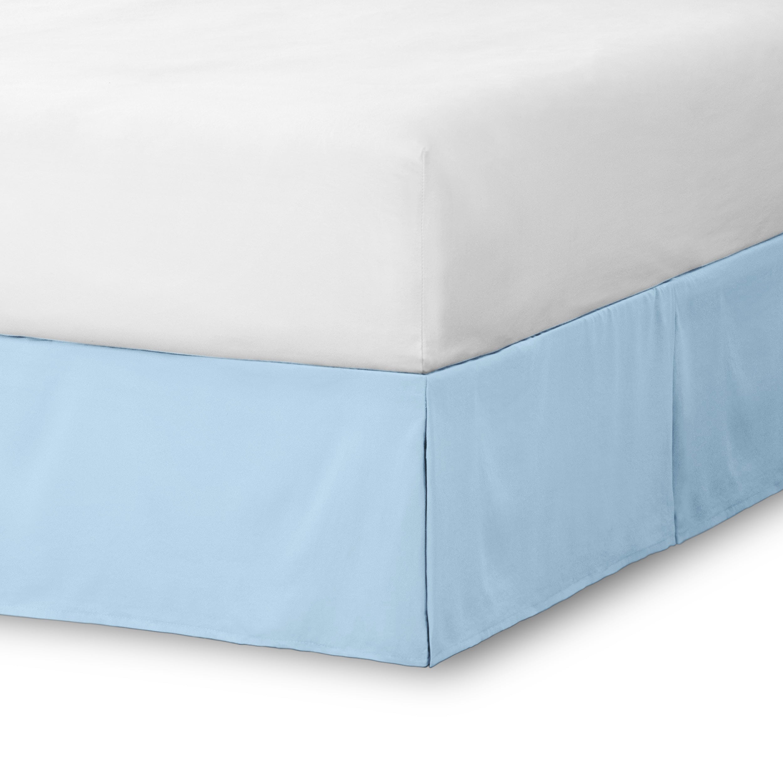 The corner of a bed skirt on a bed frame