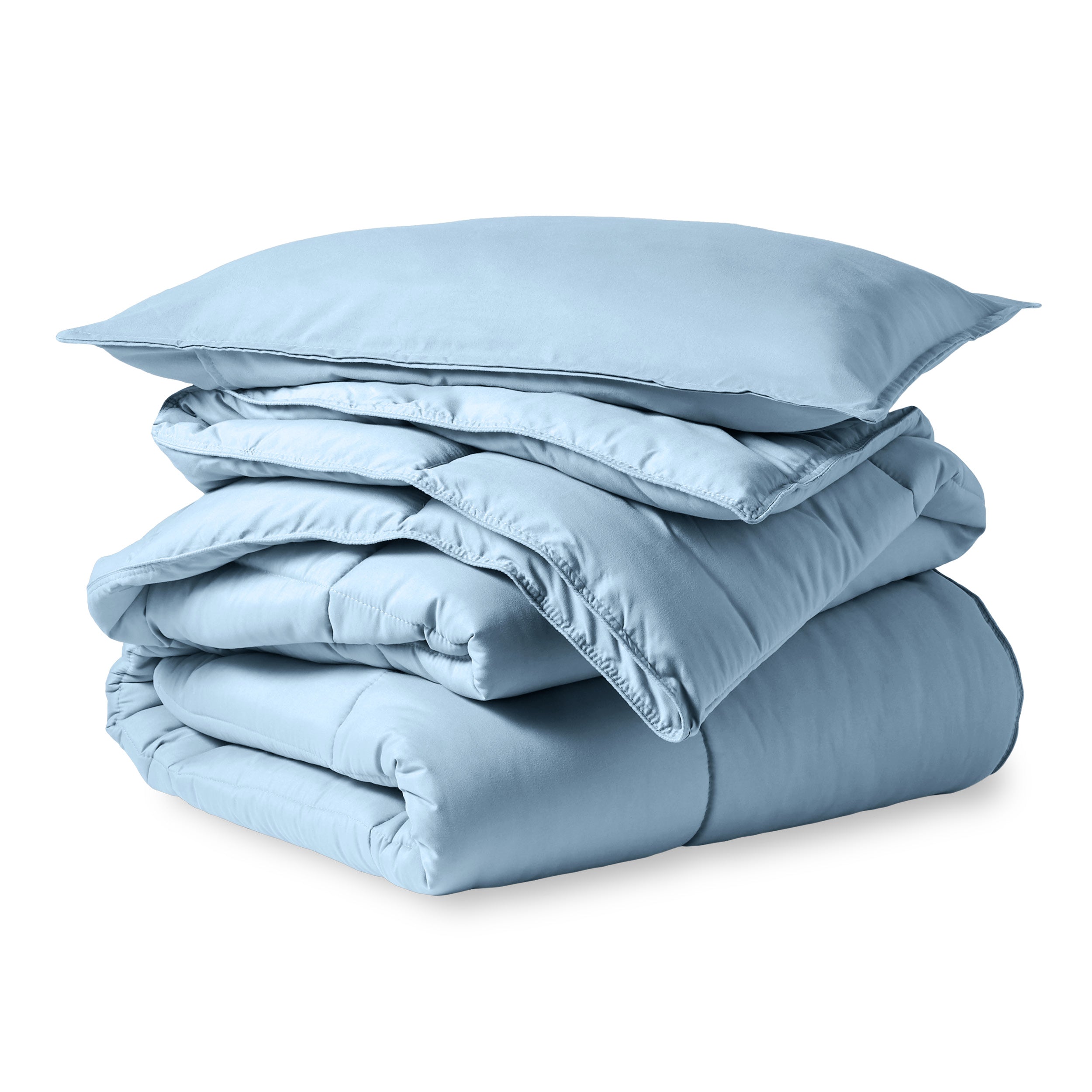 A microfiber comforter folded neatly with a pillow from above
