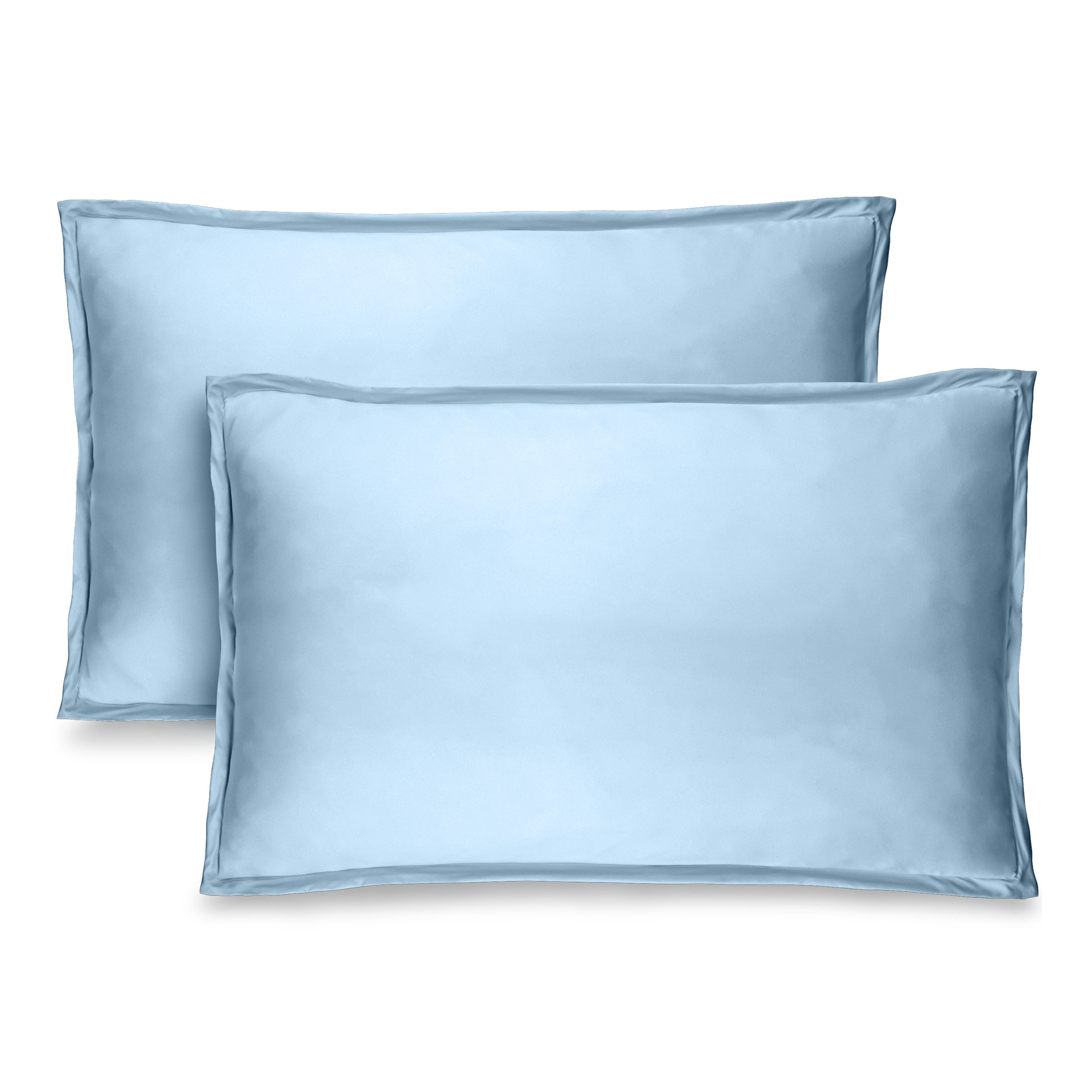 Two pillow shams on pillows standing up with one behind the other