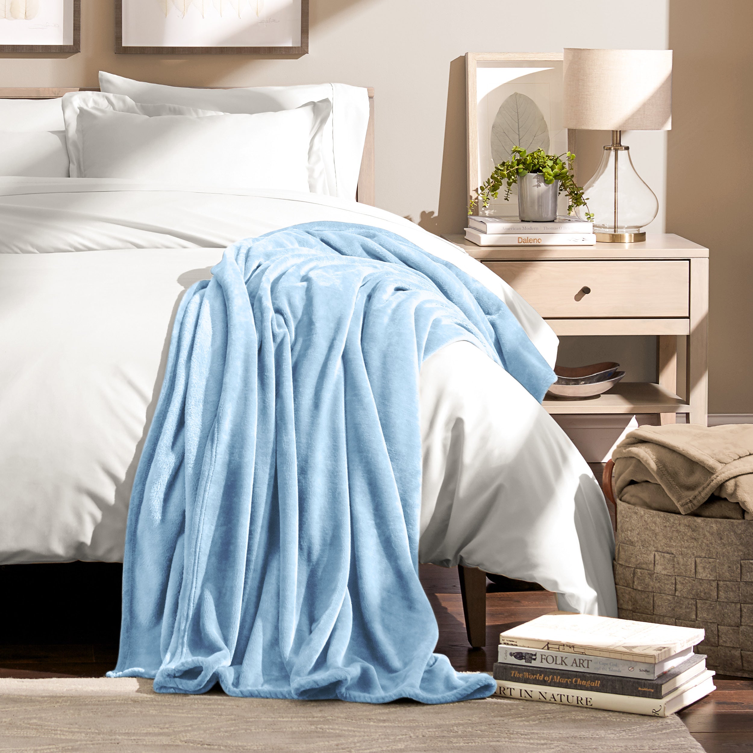 Microplush blanket laid out over a bed and folded back over itself