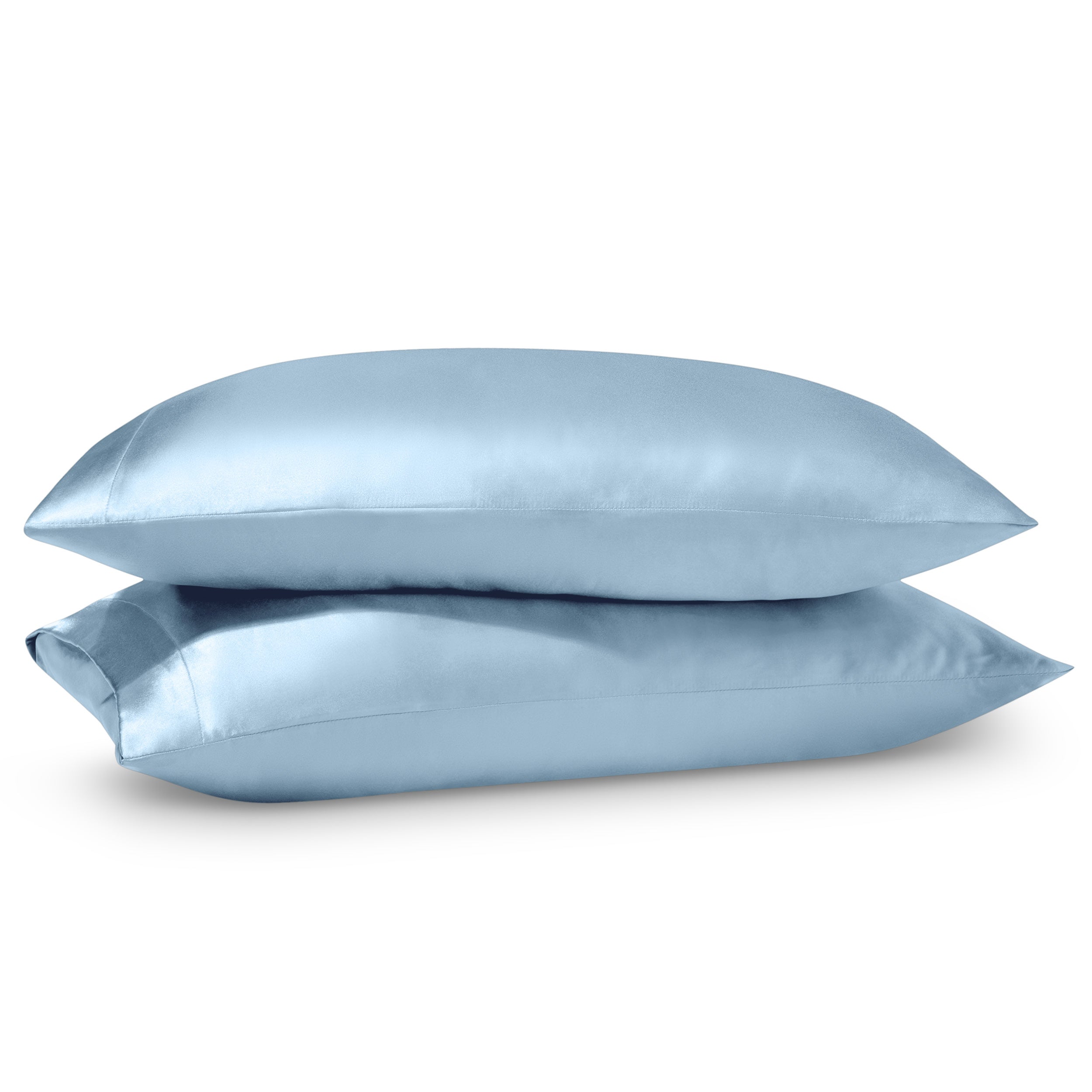 Two pillows on a white background with satin pillowcases on them.