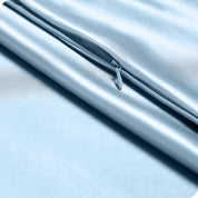 Zipper on a satin pillowcase
