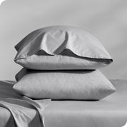 2 percale pillowcases on pillows set on a bed with matching sheets