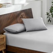 2 pillows with percale pillowcases on a bed