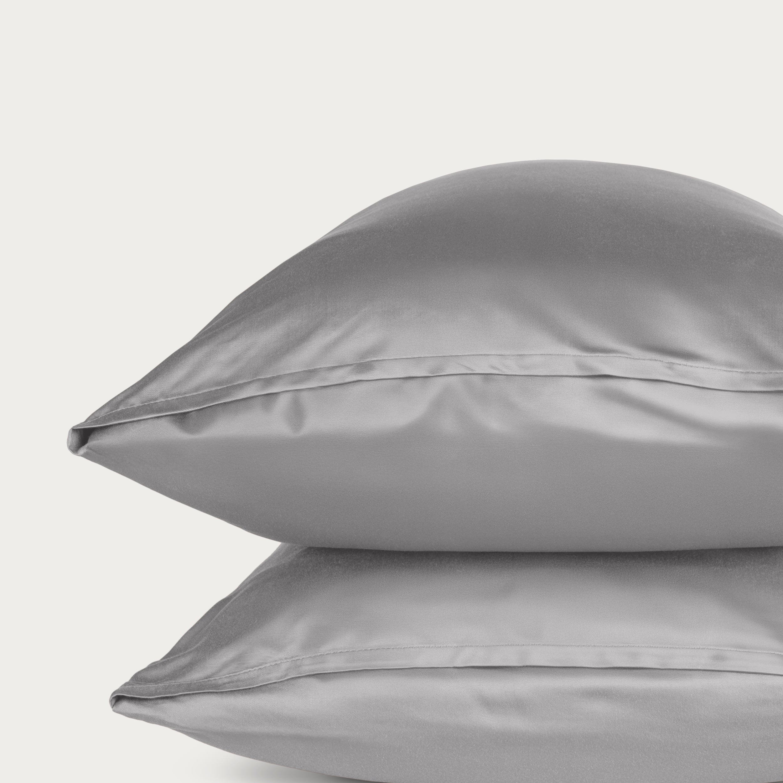 Two bamboo pillowcases on a light gray background