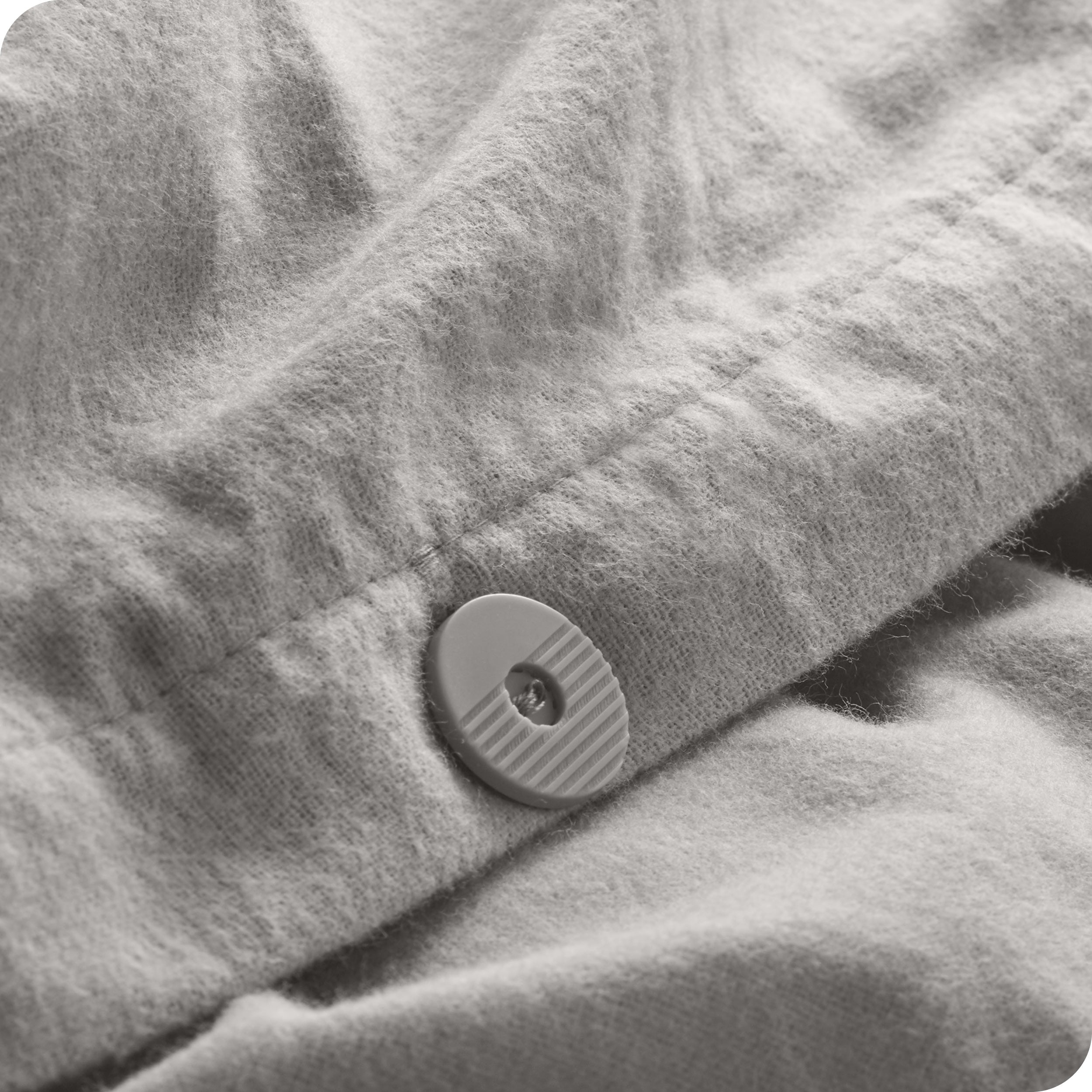 A close up of the tie corner of the duvet cover.