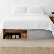 A split image showing a bed without a bed skirt on the left and with a bed skirt on the right.