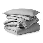 A microfiber comforter folded neatly with a pillow from above