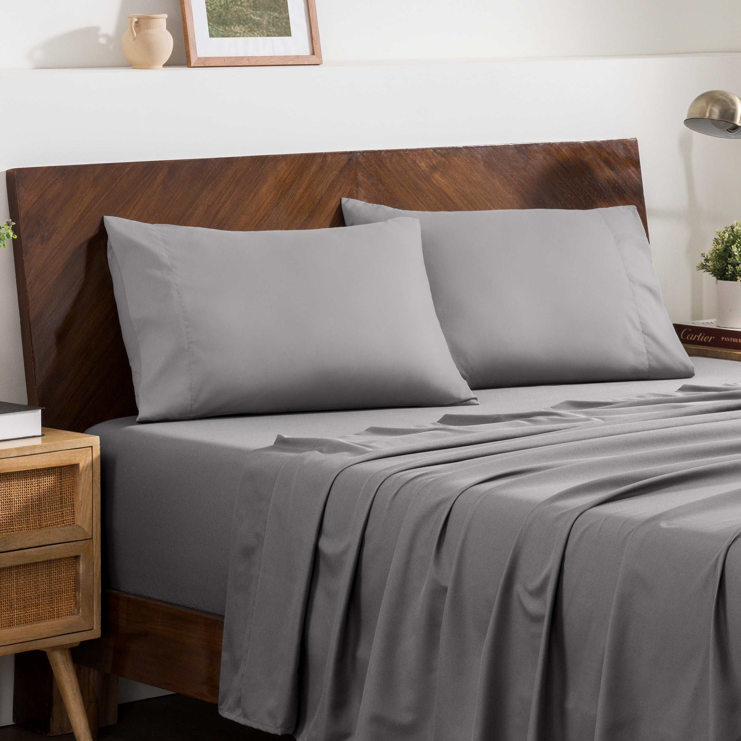 2 pillowcases on pillows on a nicely made bed