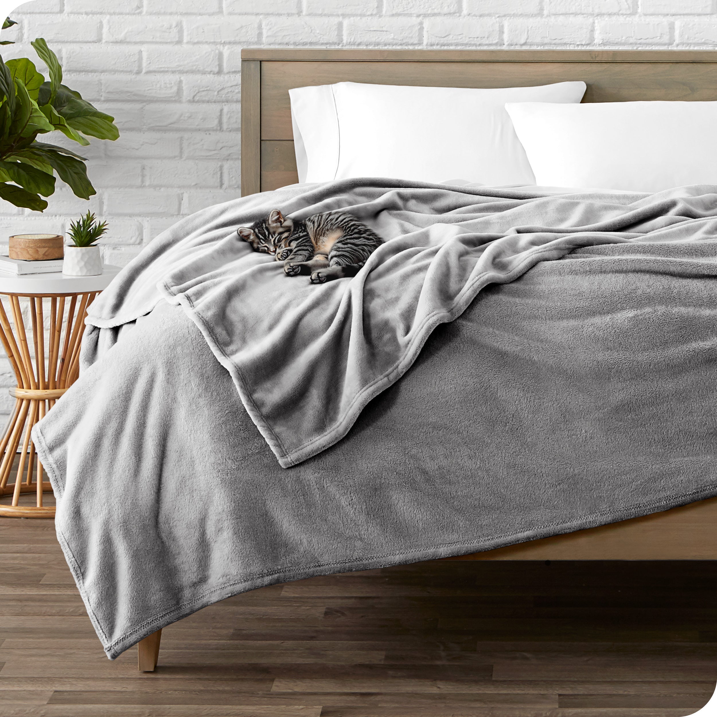 Microplush blanket laid out over a bed and folded back over itself