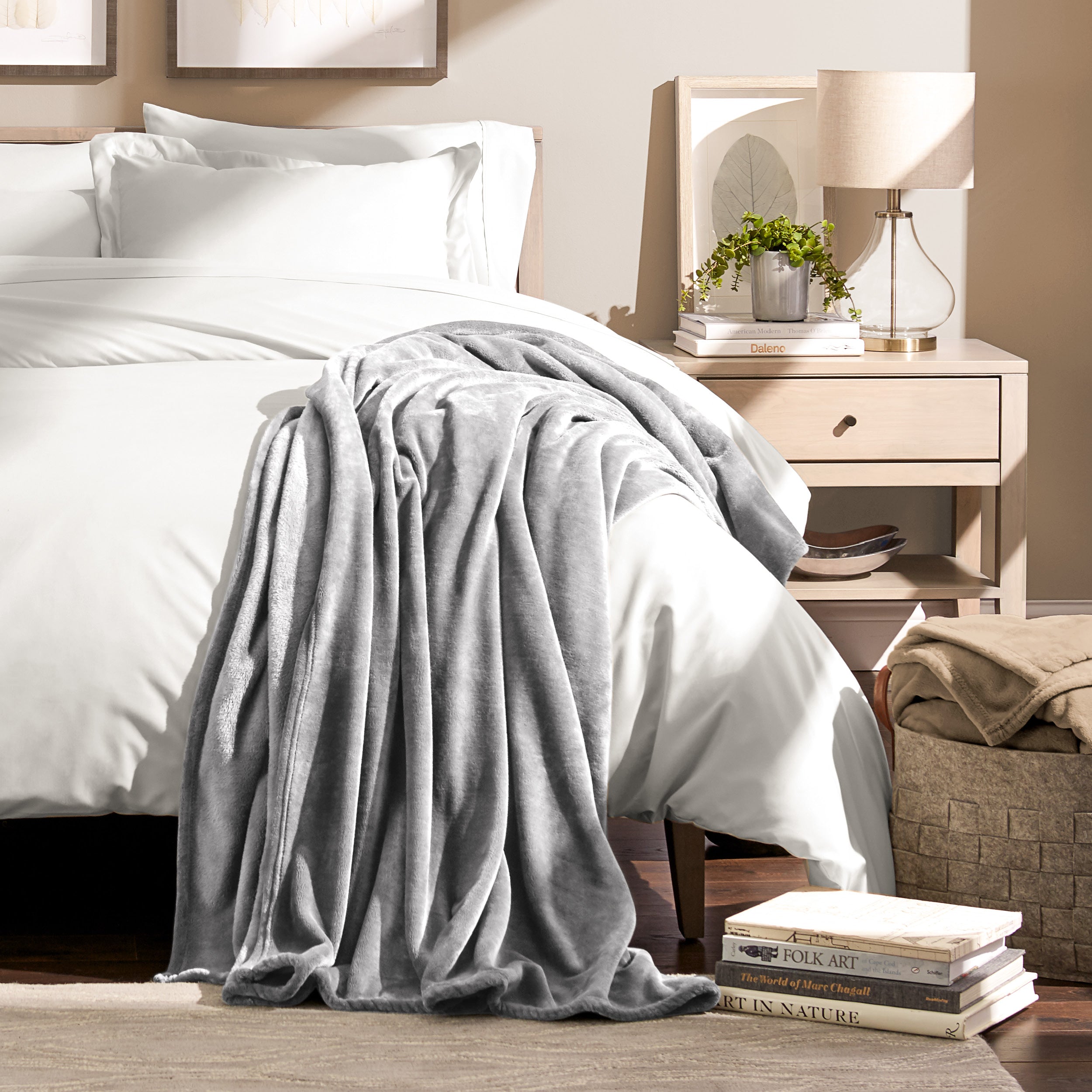 Microplush blanket laid out over a bed and folded back over itself