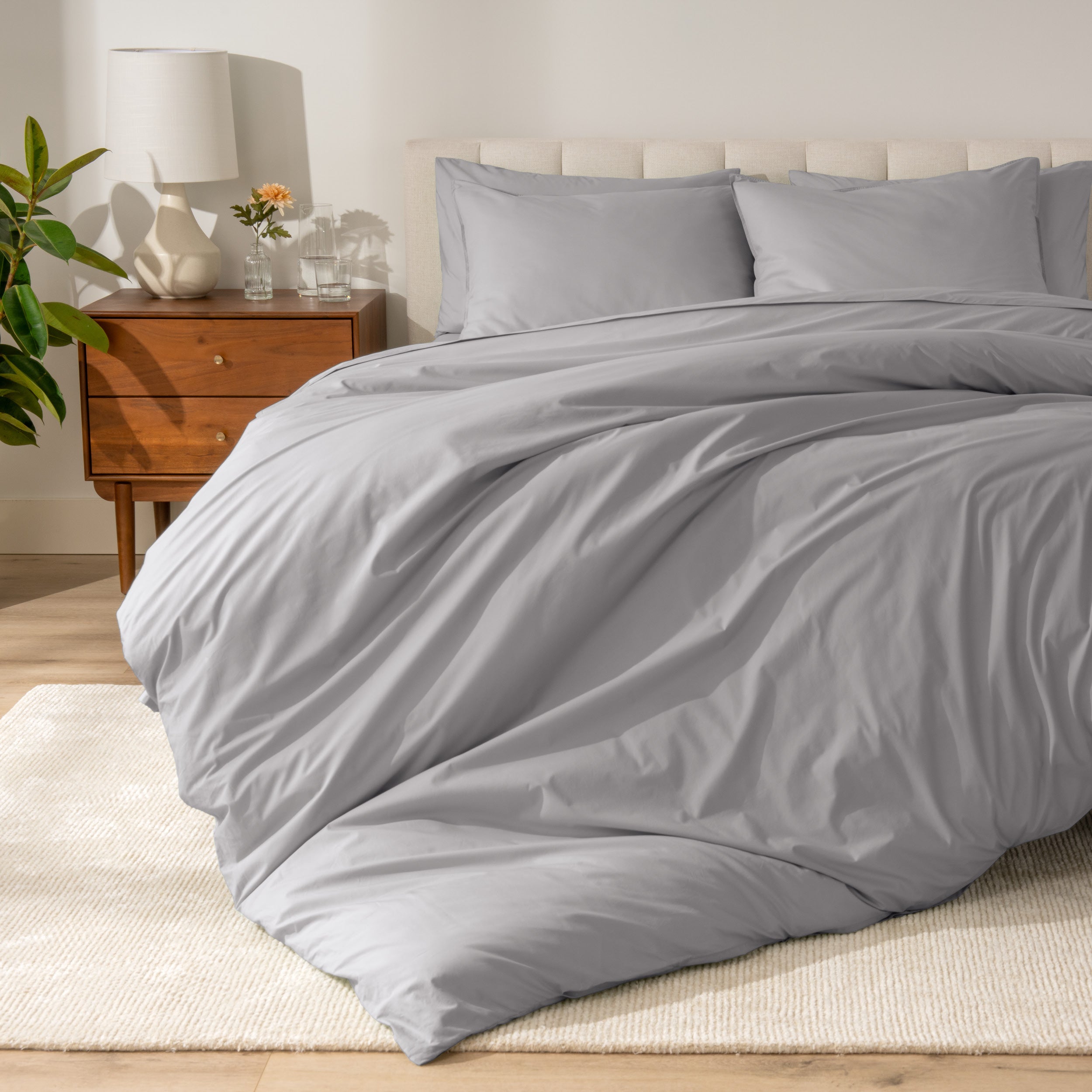 A modern bed with a organic cotton percale duvet cover on.