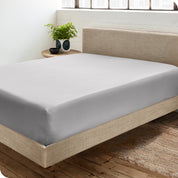 A sateen fitted sheet on a bed