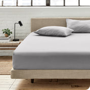 An organic cotton fitted sheet on a mattress
