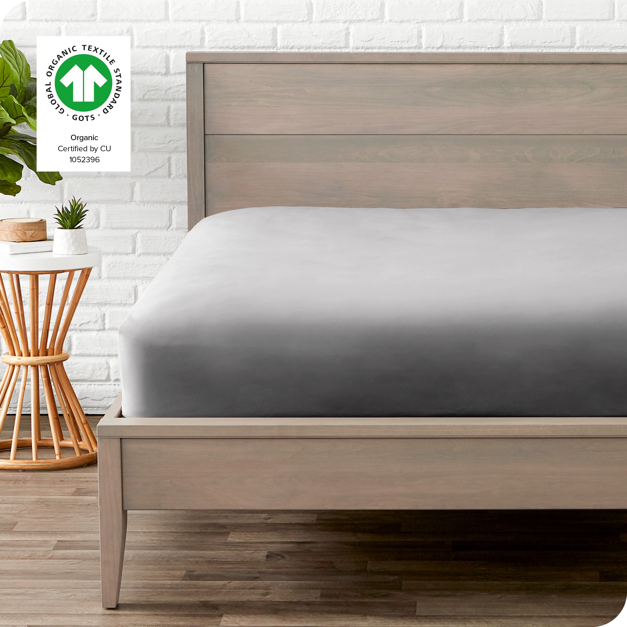 An organic percale bottom sheet on a mattress