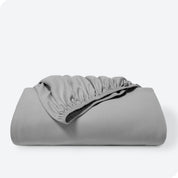 A single organic cotton fitted sheet folded