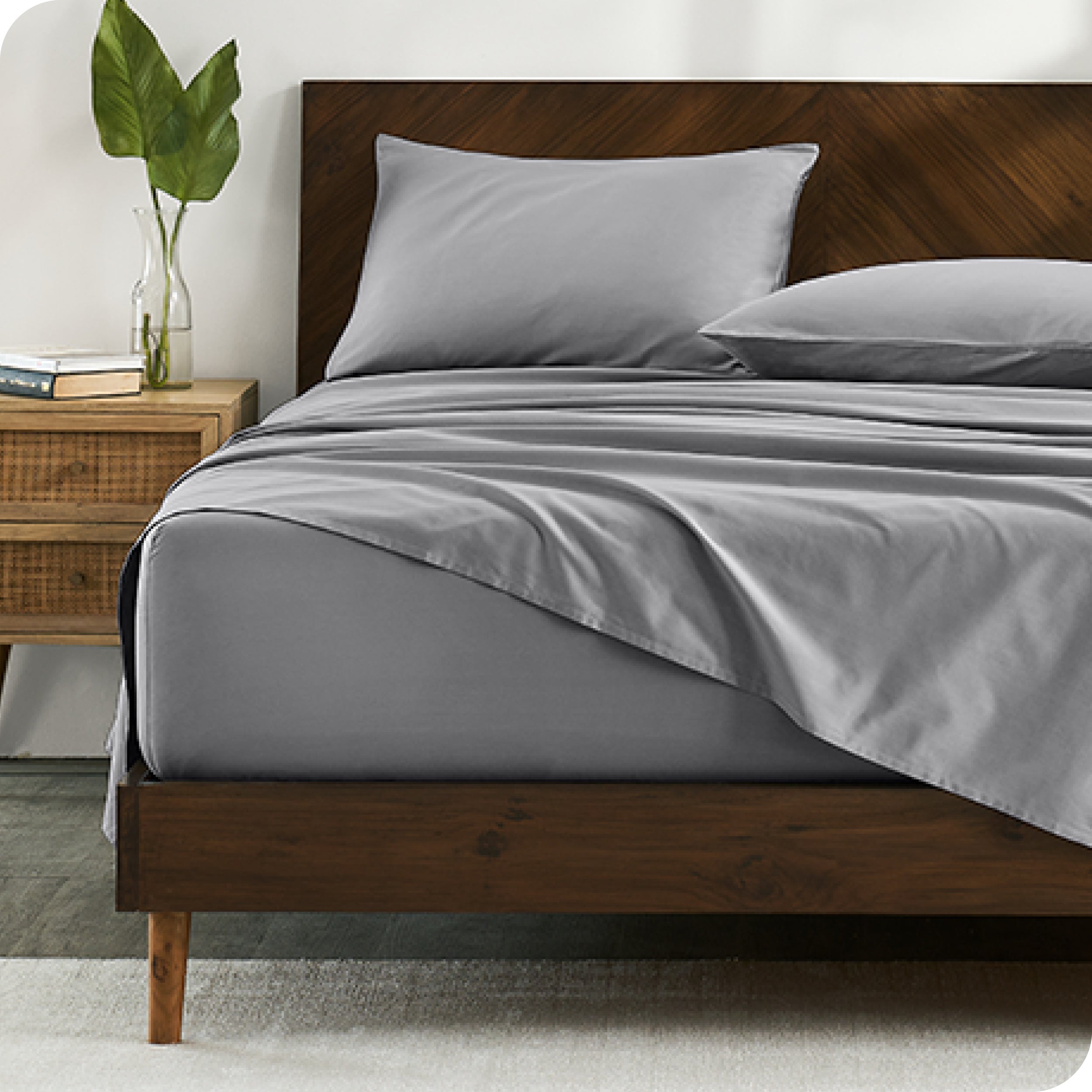 Percale sheets on bed in a modern bedroom