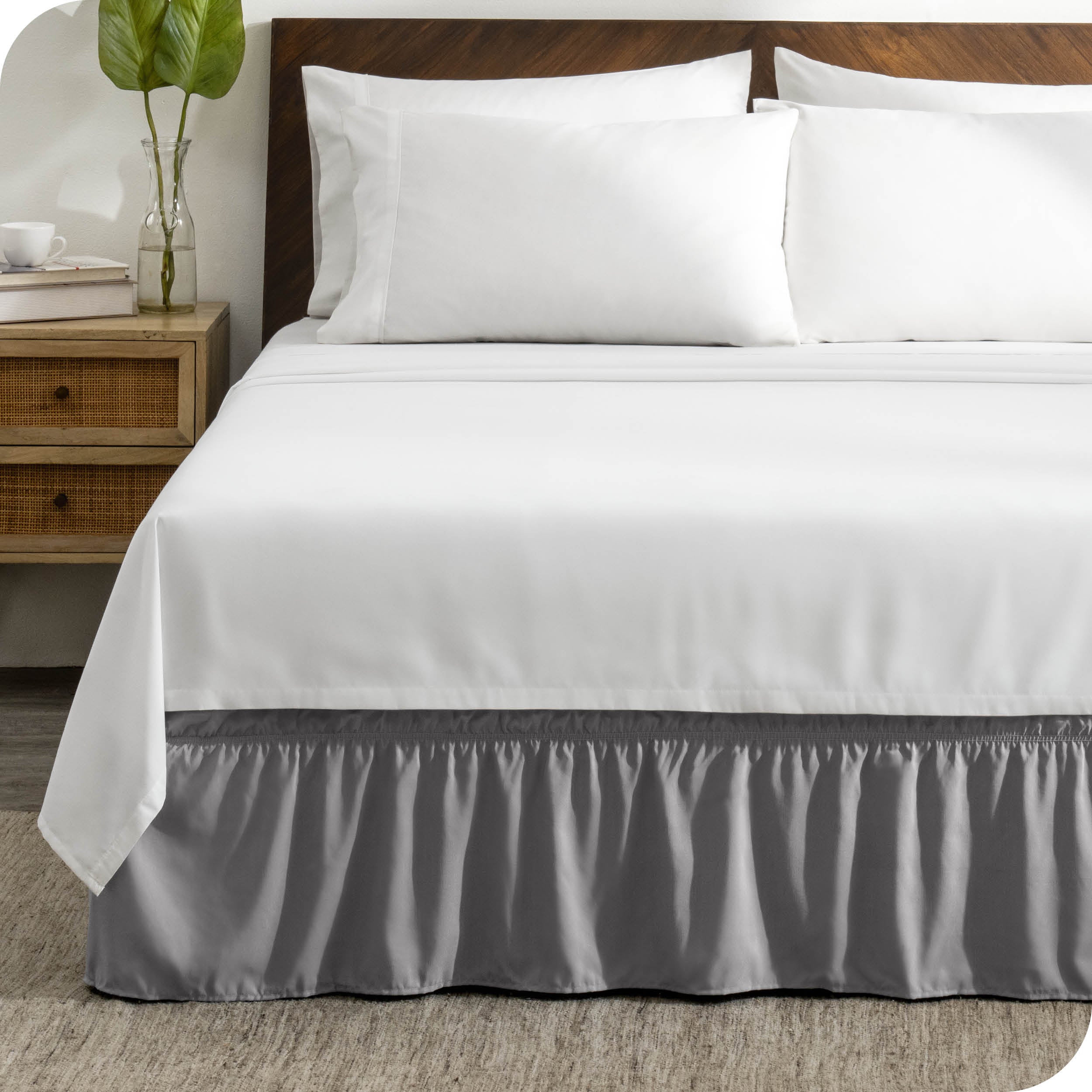 A wrap around bed skirt on a bed