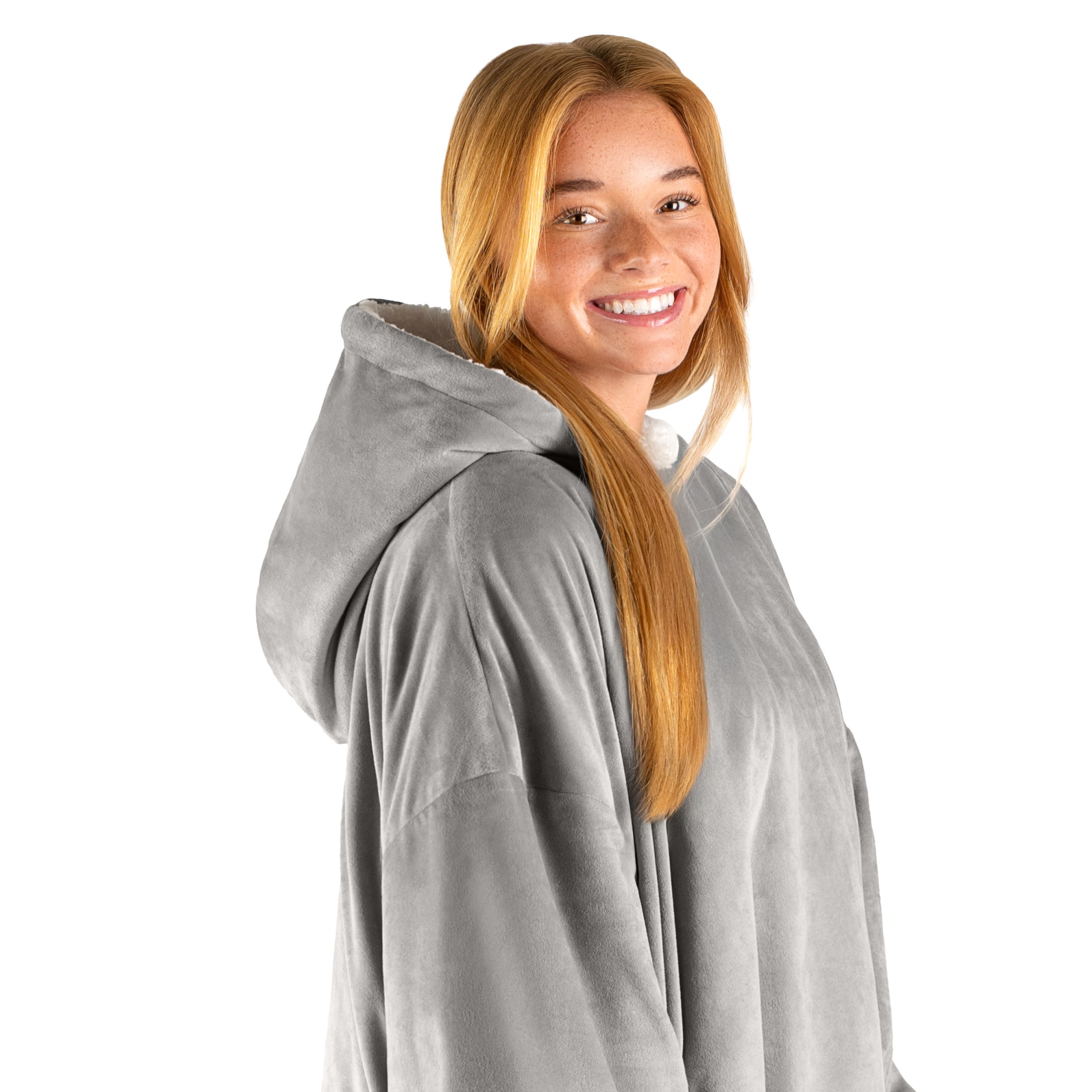 An adult with a hooded wearable blanket on