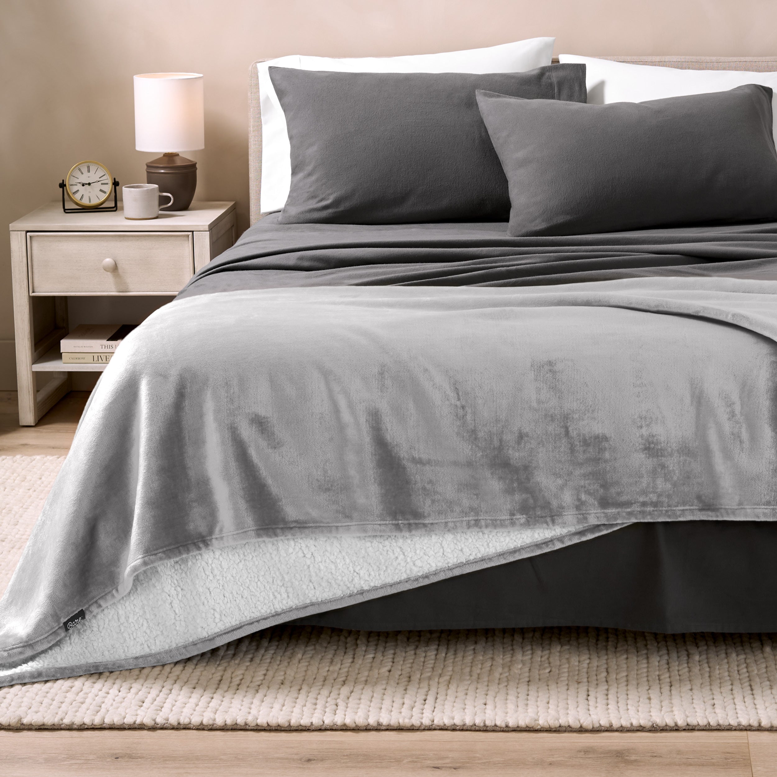 Sherpa Blanket laying on a bed folded over itself part way