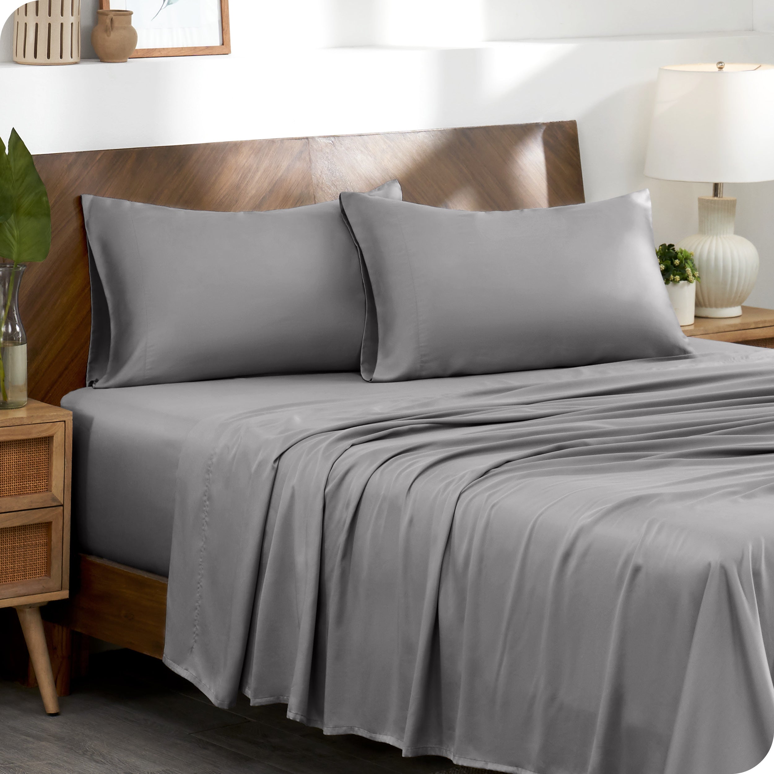 TENCEL™ pillowcases on pillows near a wooden headboard