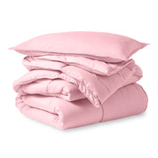A microfiber comforter folded neatly with a pillow from above