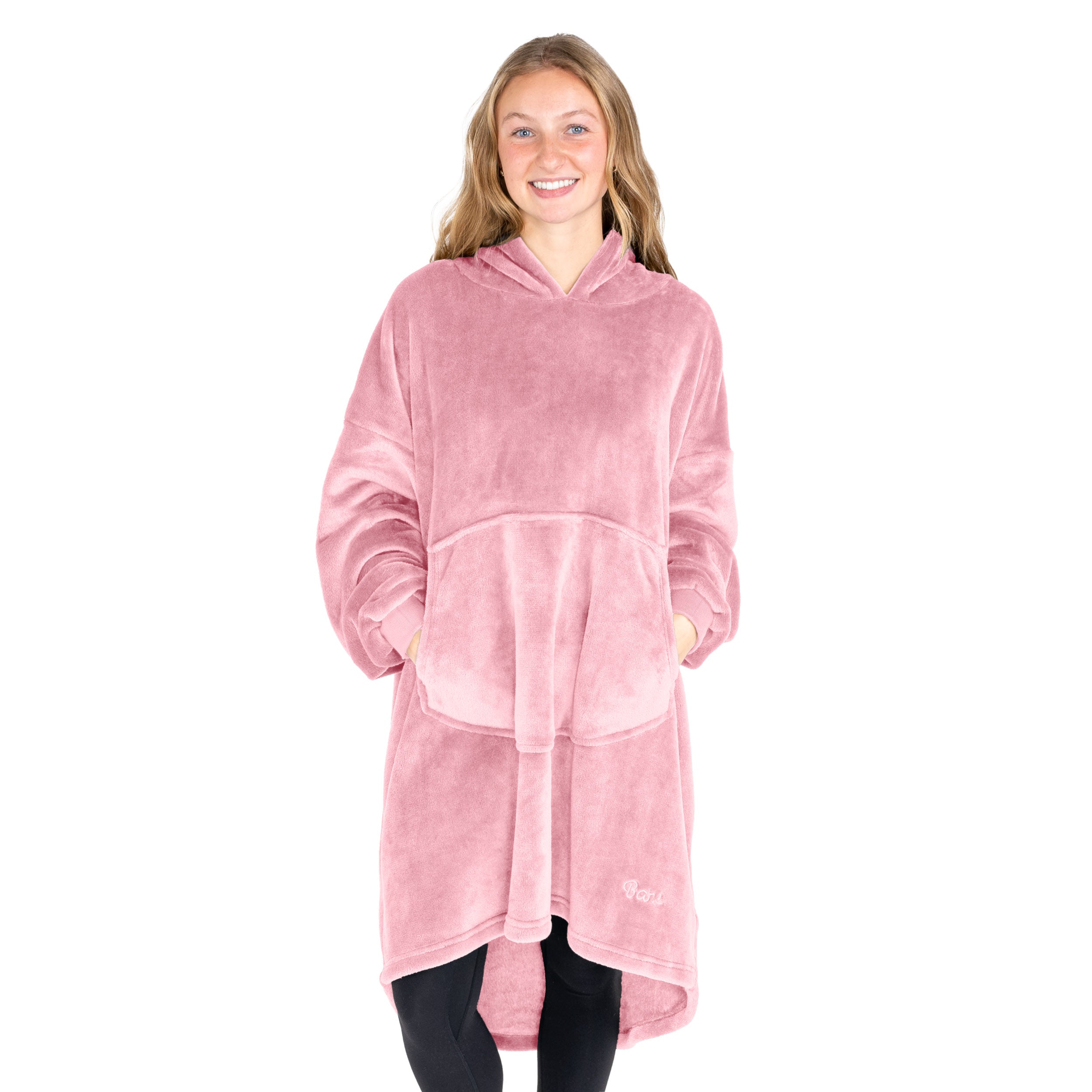 An adult with microplush wearable blanket on