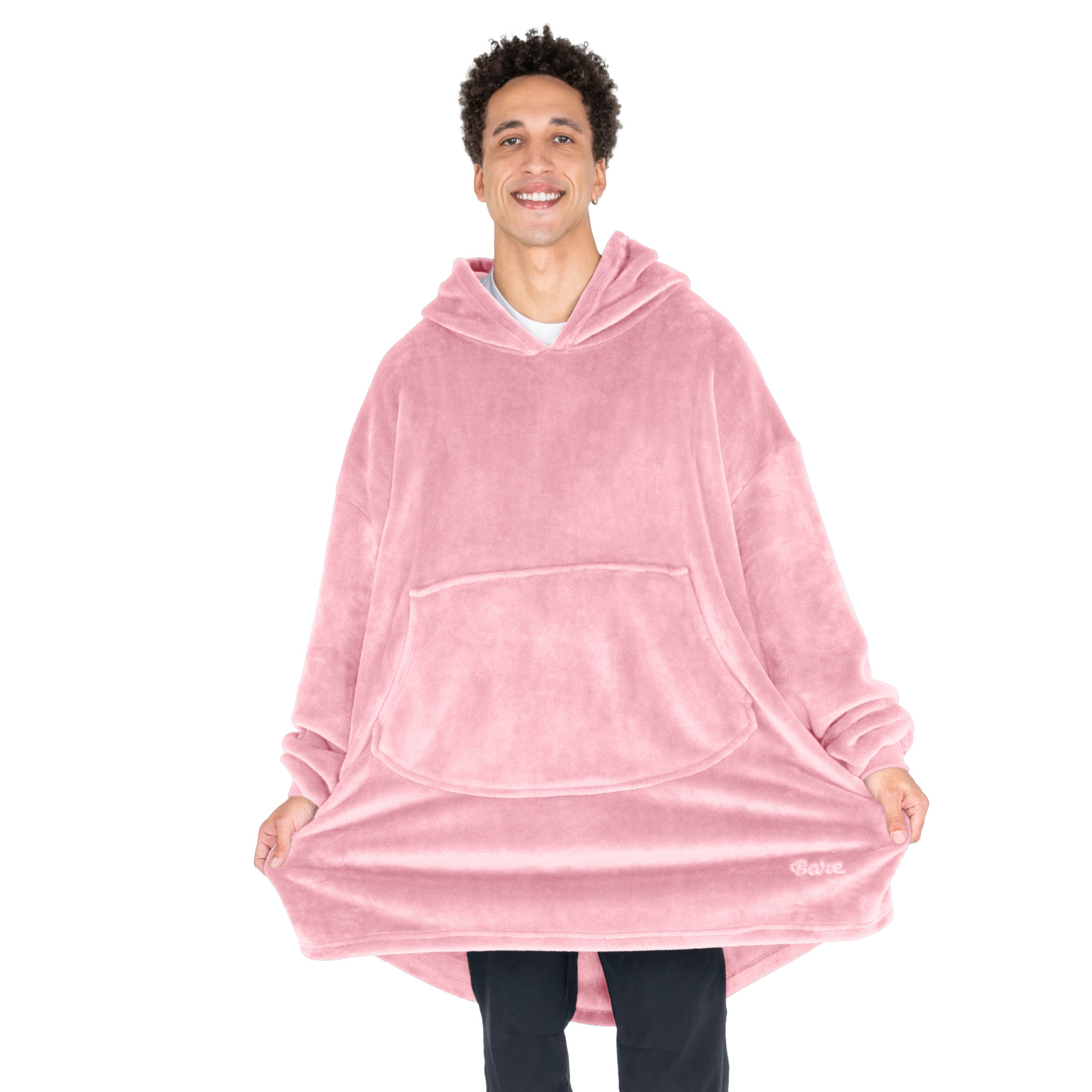 An adult with microplush wearable blanket on