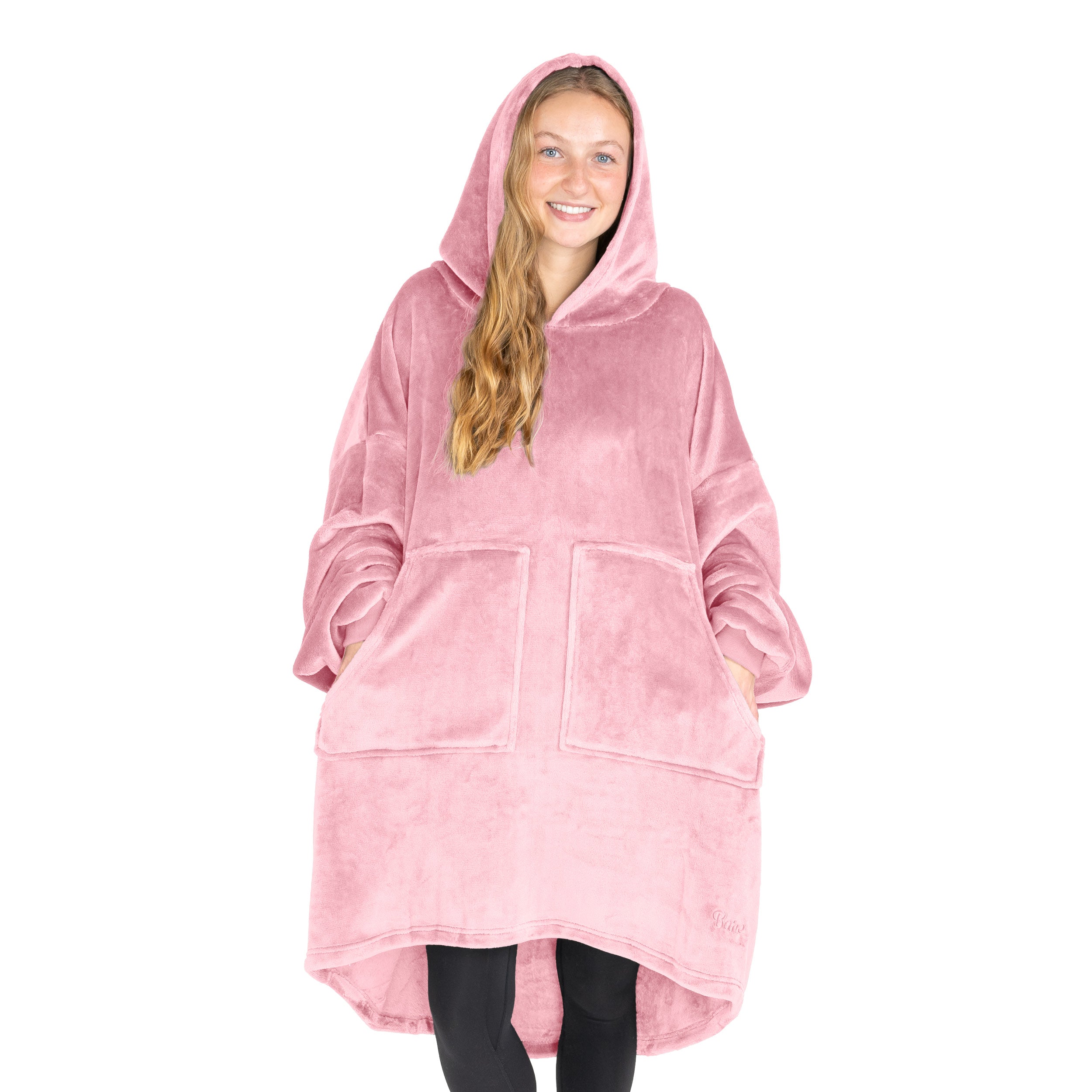An adult with microplush wearable blanket on