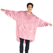 An adult with microplush wearable blanket on