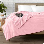 Microplush blanket laid out over a bed and folded back over itself