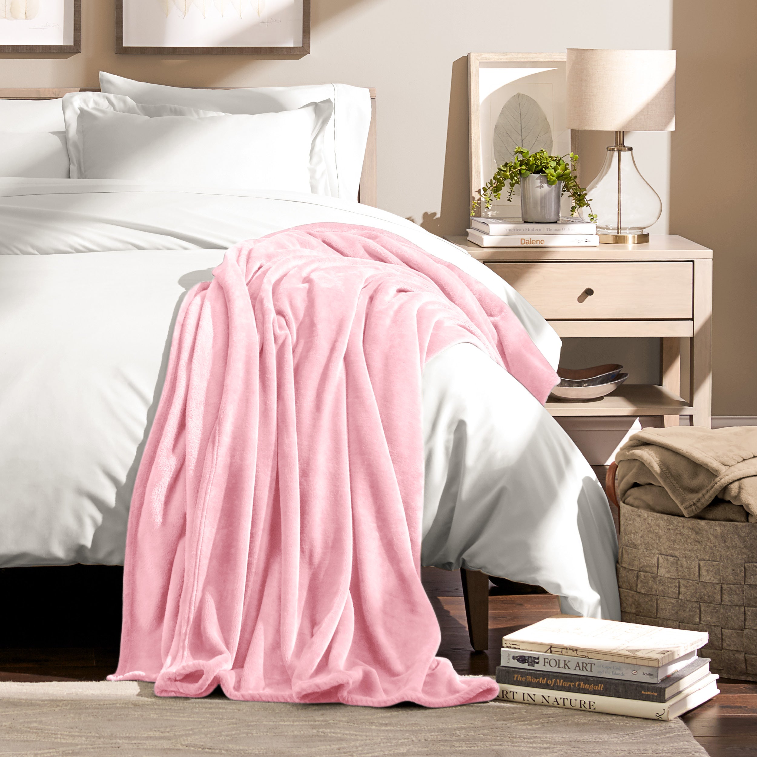 Microplush blanket laid out over a bed and folded back over itself