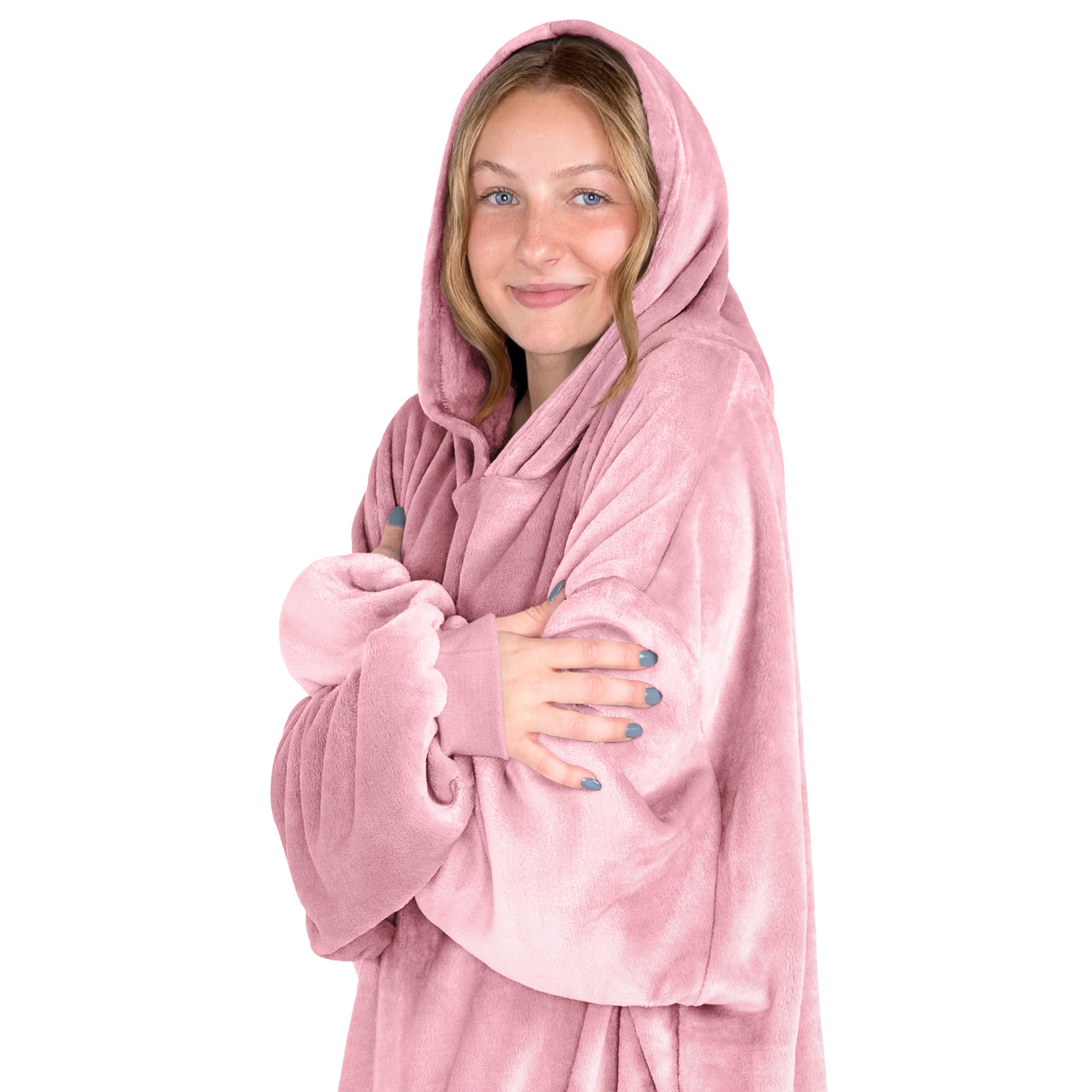 A woman is snuggled up in microplush wearable blanket