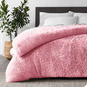  A pink shaggy duvet cover on a bed