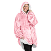 An adult with a sherpa wearable blanket on