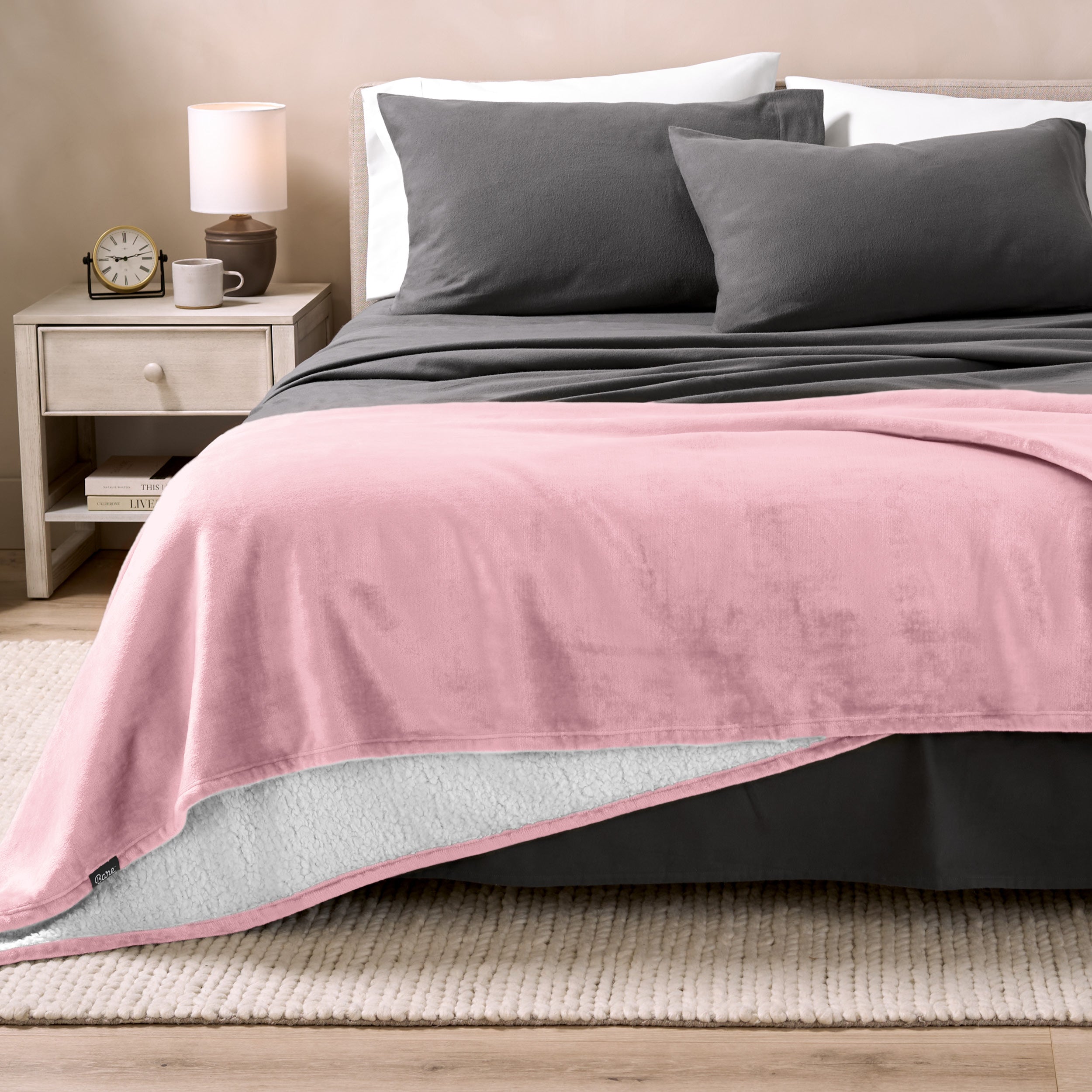 Sherpa Blanket laying on a bed folded over itself part way