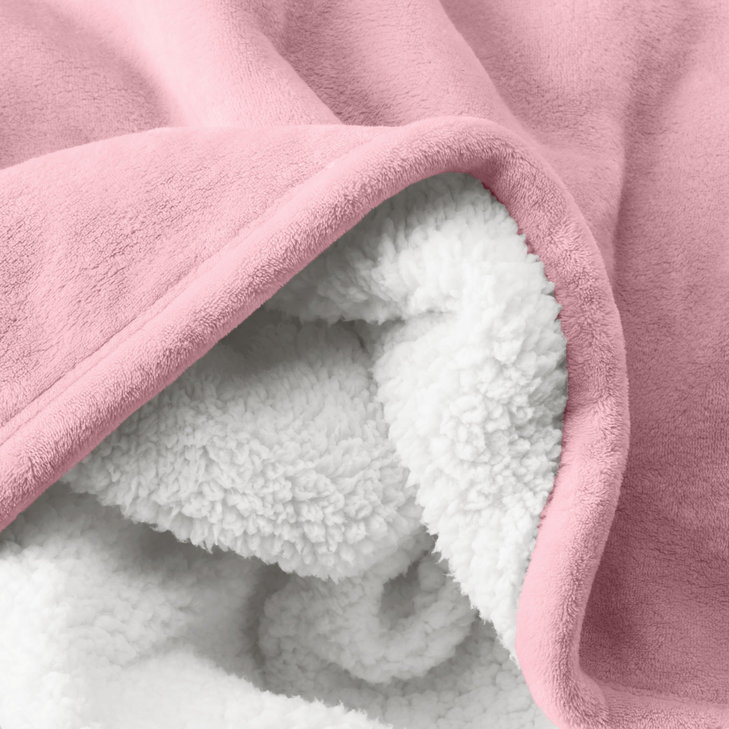 Close up of sherpa blanket showing texture of velvety soft side and sherpa backing